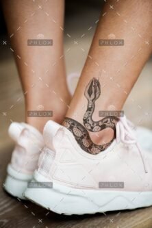 demo-attachment-596-closeup-of-ankle-tattoo-of-a-woman-PJMLBNC1